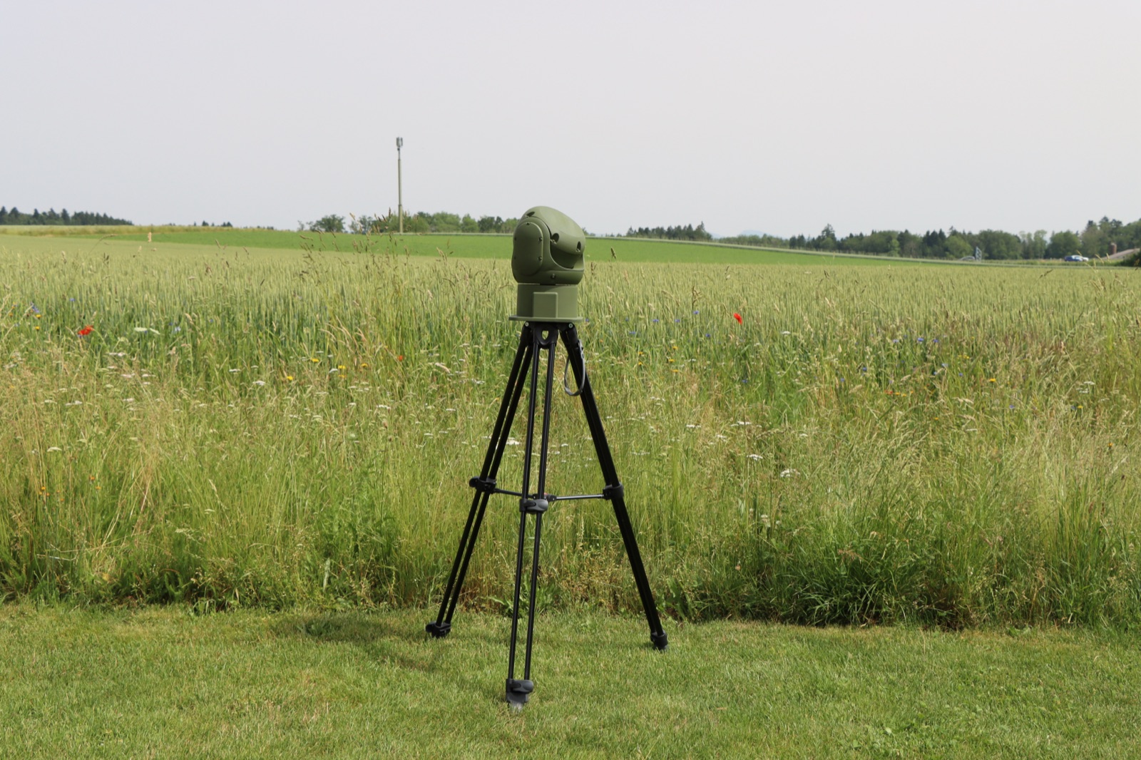 The Y3077A on a tripod at the edge of a field
